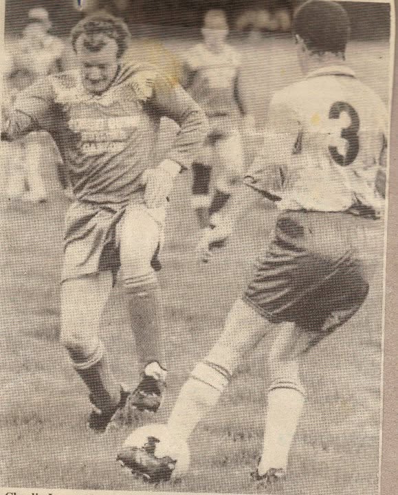 Crettyard United player taking on a defender, black and white photo