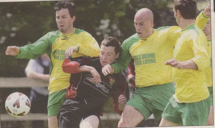 Crettyard United players in James Dunne Blocklaying kit battling for the ball