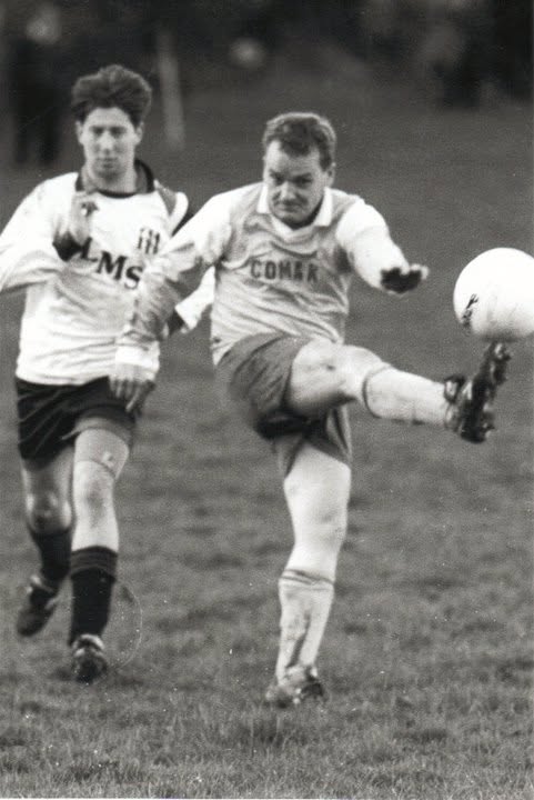 Player clearing the ball under pressure