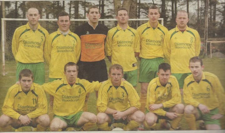 Crettyard United team photo in yellow Diamond Woodcraft kit