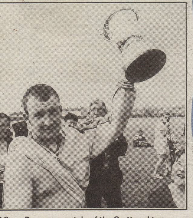 Crettyard United captain lifting the cup above his head