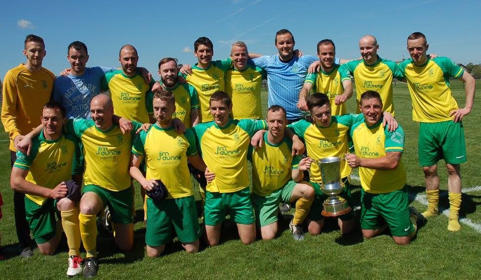 Crettyard United squad with the cup in Jim Dunne Electrical kit