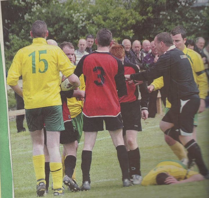 Players and officials in a heated moment during a Crettyard United match