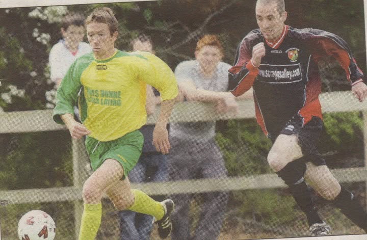 Crettyard United player running with the ball past an opponent