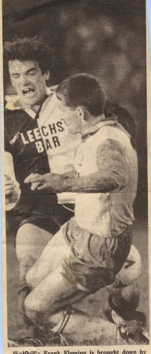 Newspaper clipping of a Crettyard United player being brought down in a tackle