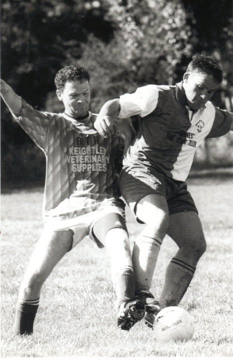 Players tussling for possession in an old Crettyard United match