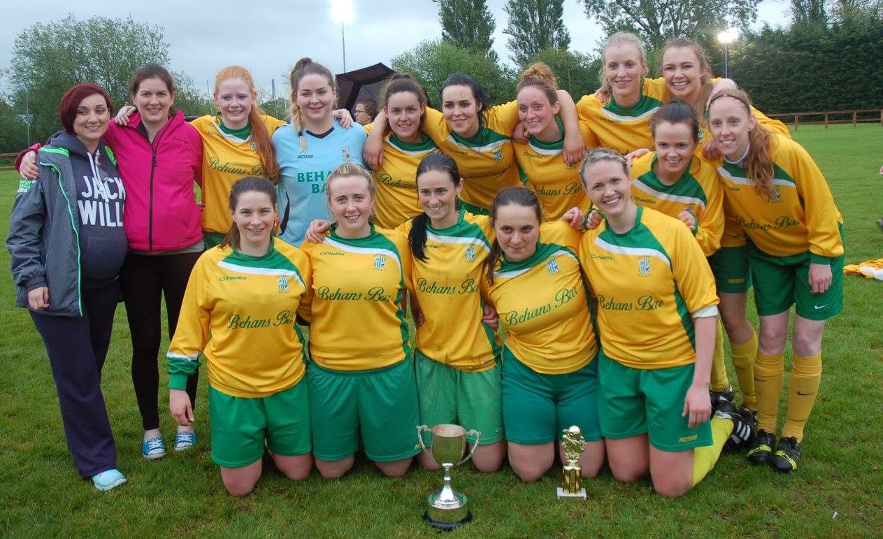 Crettyard United ladies team with the cup and a trophy in Behans Bar kit