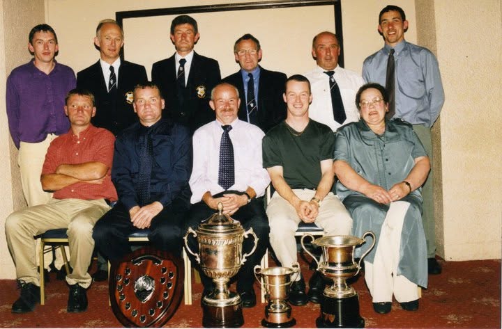 Crettyard United committee with club trophies