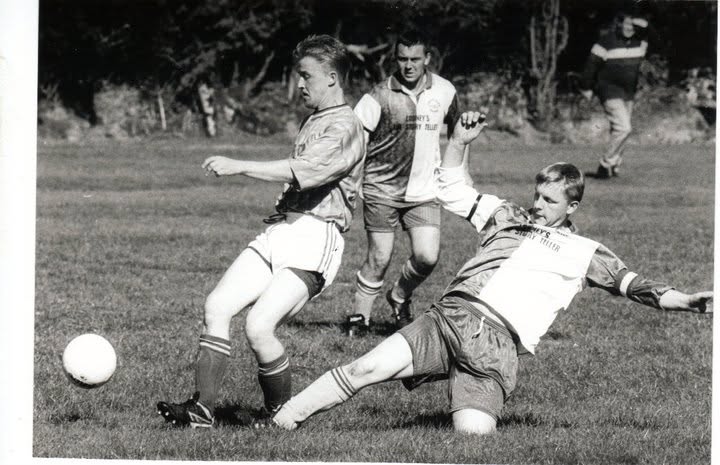 Sliding tackle during an old Crettyard United match