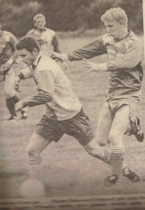 Crettyard United player winning a tackle, black and white newspaper photo