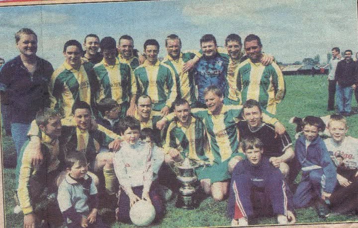 Crettyard United squad and supporters with a trophy