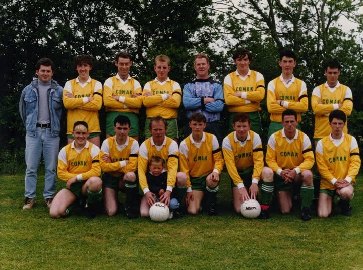 Crettyard United squad photo in yellow and green Comak kit