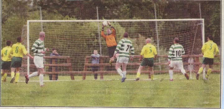 Goalkeeper claiming a high ball as Crettyard United attack