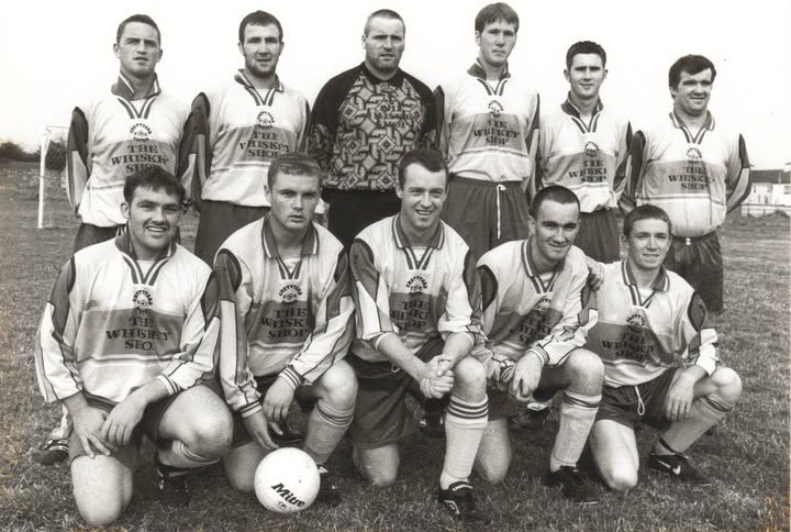 Crettyard United team photo in The Whiskey Shop kit