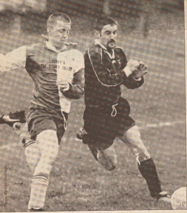 Newspaper photo of a Crettyard United player racing an opponent for the ball