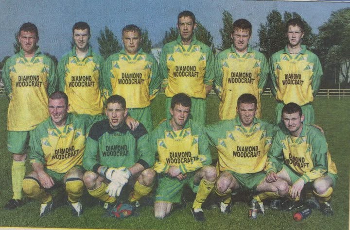 Crettyard United squad photo in Diamond Woodcraft green and gold kit