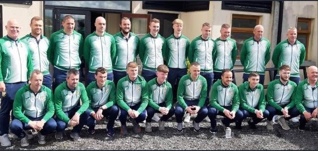 Crettyard United squad in green tracksuits outside the clubhouse